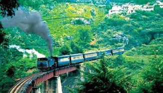 Here is a beautiful image representing the serene and scenic This is typical of Ooty's picturesque views, inviting visitors to enjoy tranquility and natural beauty in train iconic hill station.of ooty experience the ooty bwith madurai cab booking Popular spots in Ooty that are often visually depicted include Ooty Lake, Botanical Gardens, Doddabetta Peak, and the Nilgiri Mountain Railway.