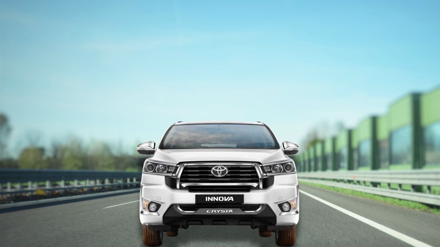 A Toyota Innova Crysta cab is shown driving on the highway, perfect for your Madurai cab booking needs.