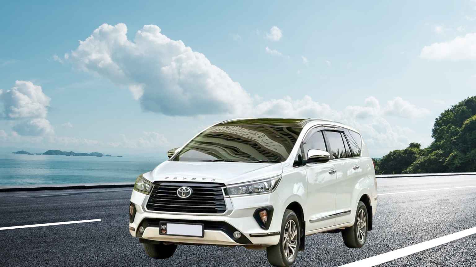 Toyota Innova Crysta cab ready for hire on the highway by the sea, available for trips in Madurai and out-of-town.