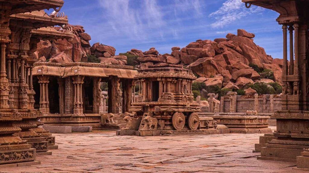 See the stone chariot and old ruins at Hampi, Karnataka—great for cab tours from Madurai to Hampi.