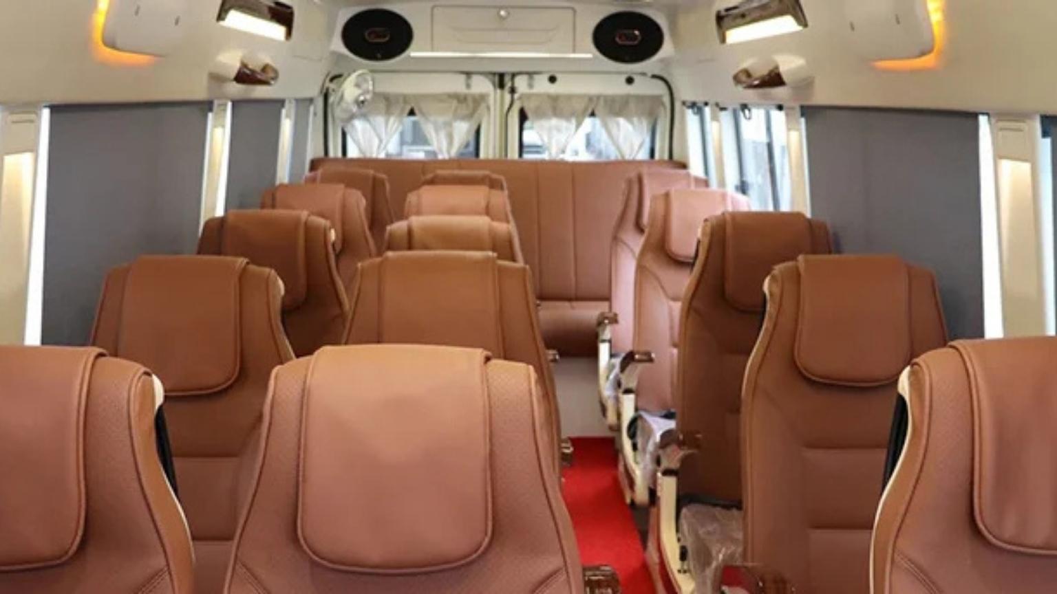 The Force Tempo Traveller van has nice brown leather seats, great for group cab bookings in Madurai.