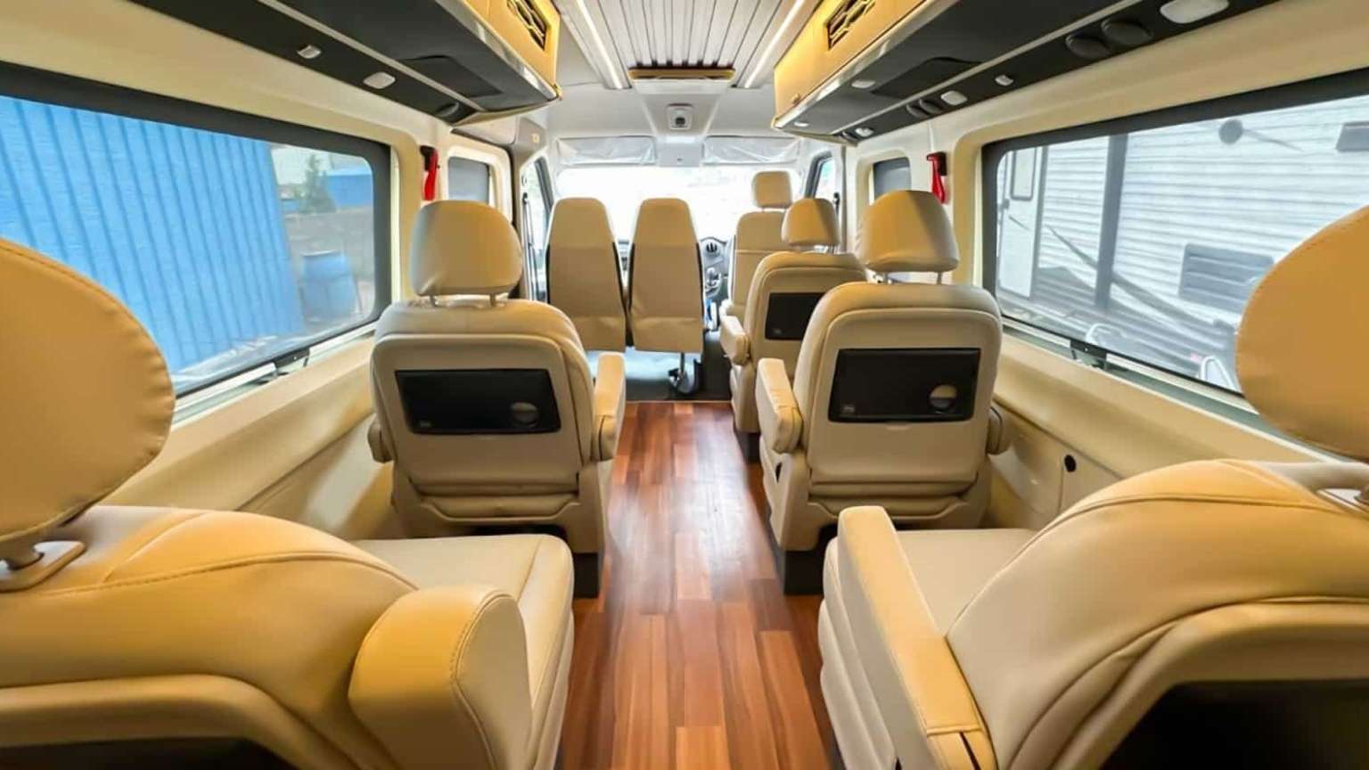 The Force Urbania van has a luxury interior with beige seats, so you can travel comfortably when you book a cab in Madurai.