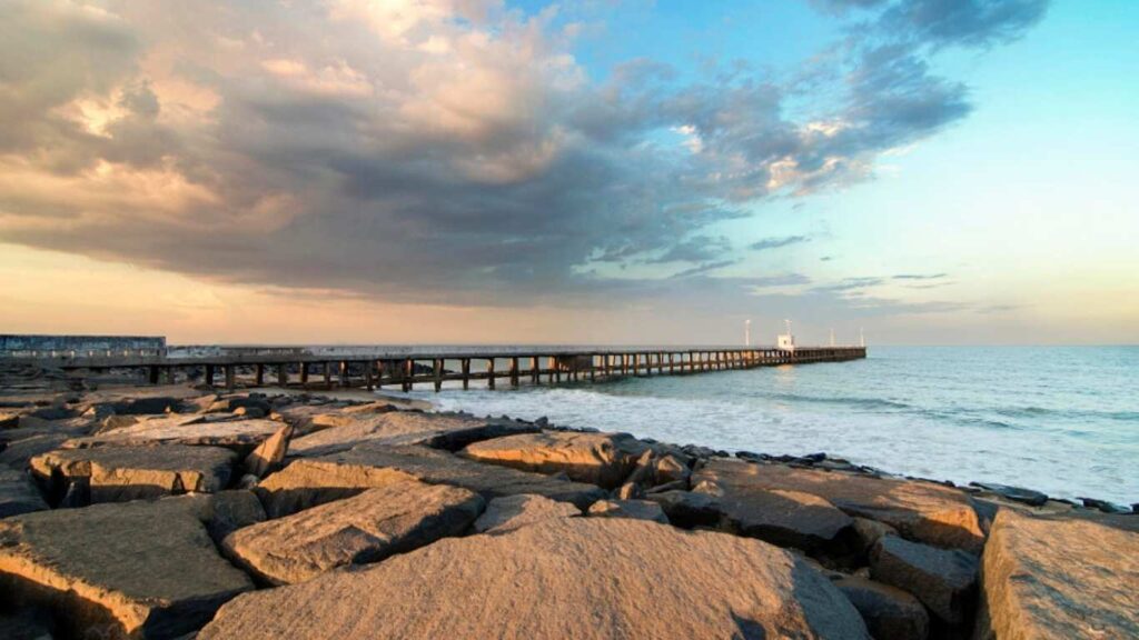 Pondicherry has a rocky beach and a long pier, offering a great view if you're booking a cab tour from Madurai.