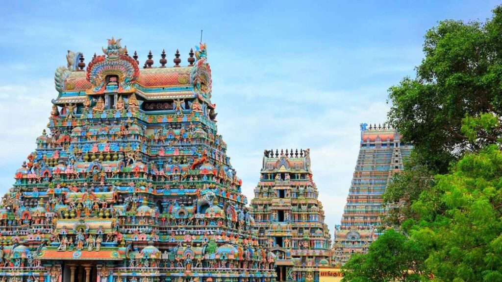 Sri Rangam temple has these bright, colorful gopurams and detailed towers that are great to see on a cab tour from Madurai.