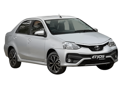 A silver Toyota Etios sedan cab is parked, viewed from the side. It's used as a taxi for both in Madurai city and trips outside the city.